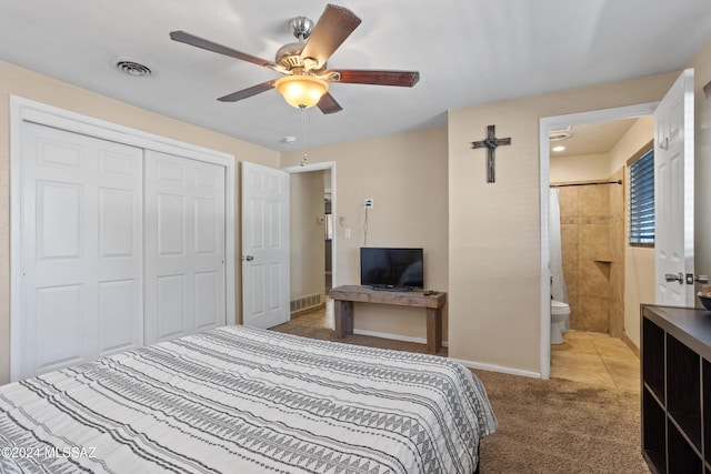 carpeted bedroom with a closet, ceiling fan, and connected bathroom