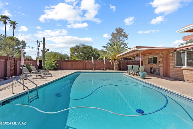 view of swimming pool with a patio area