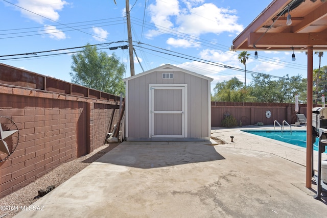 view of outdoor structure with a fenced in pool