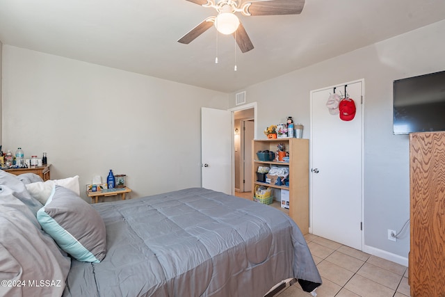 bedroom featuring light tile patterned flooring and ceiling fan