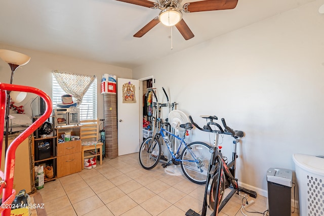 interior space featuring ceiling fan and light tile patterned floors