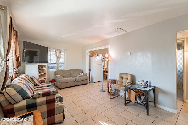 living room with light tile patterned floors