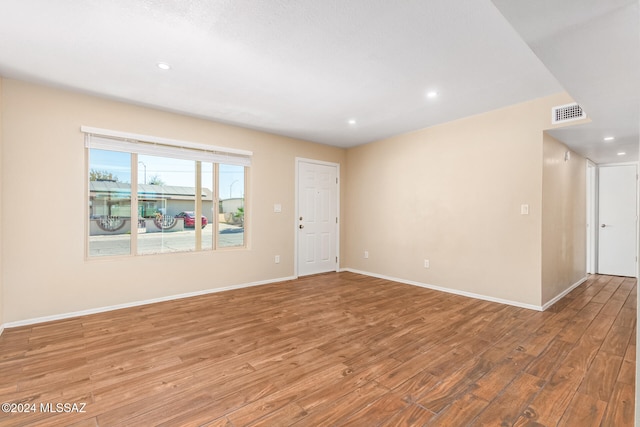 empty room featuring hardwood / wood-style flooring