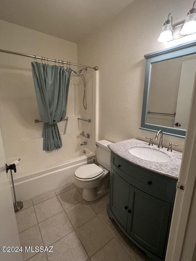 full bathroom with tile patterned flooring, shower / tub combination, vanity, and toilet