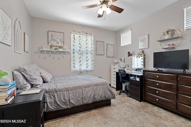 bedroom with ceiling fan and light tile patterned flooring