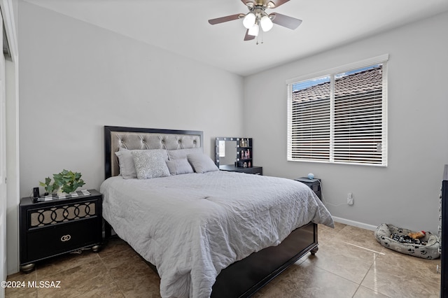 bedroom with tile patterned floors and ceiling fan