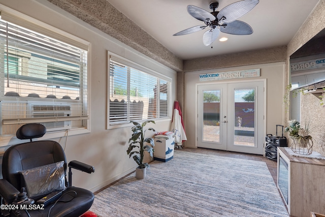 workout area featuring ceiling fan and french doors