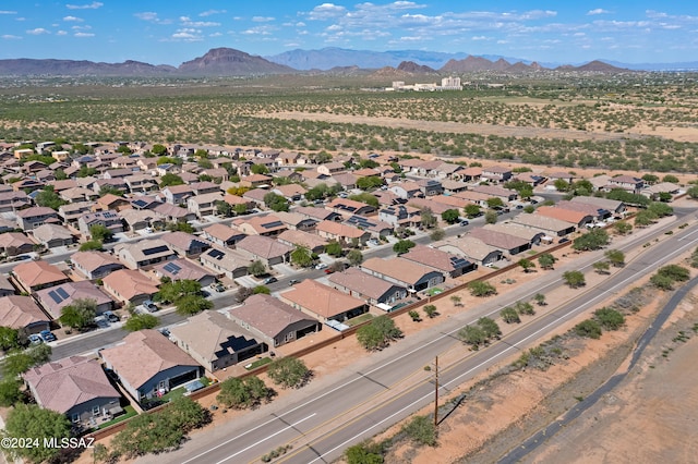 birds eye view of property with a mountain view