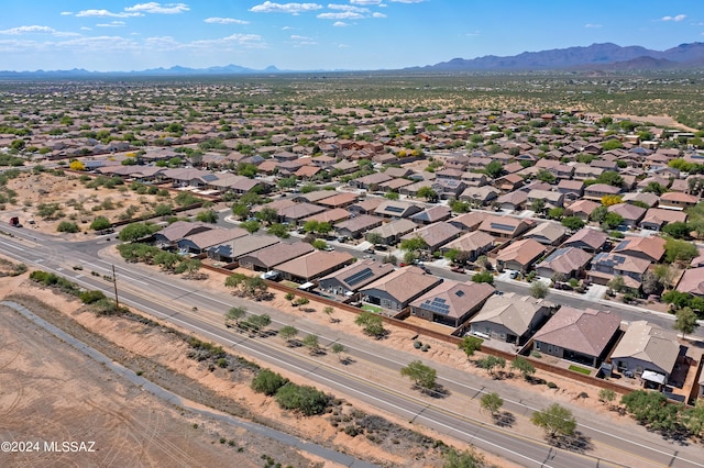 birds eye view of property with a mountain view