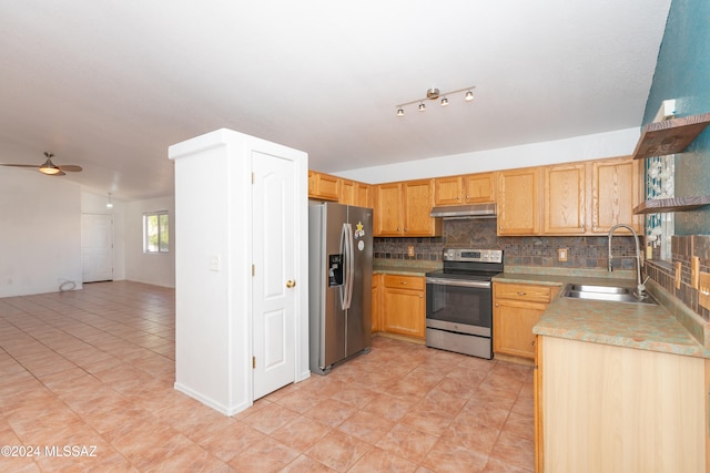 kitchen featuring tasteful backsplash, ceiling fan, light tile patterned flooring, sink, and stainless steel appliances