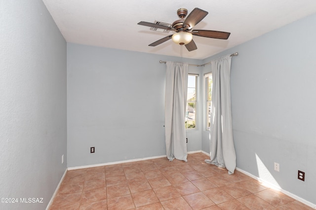 unfurnished room featuring light tile patterned floors and ceiling fan