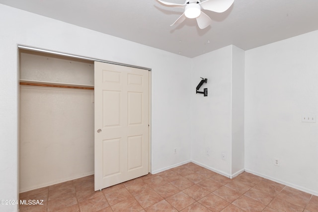 unfurnished bedroom with a closet and ceiling fan