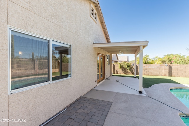 view of patio featuring a fenced in pool