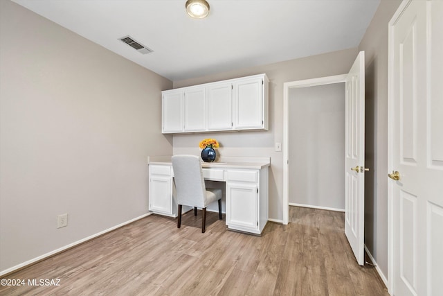 office space with light wood-type flooring