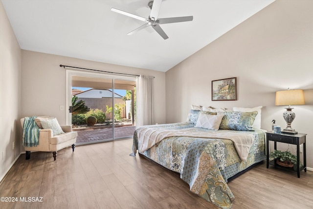 bedroom featuring hardwood / wood-style floors, ceiling fan, lofted ceiling, and access to outside