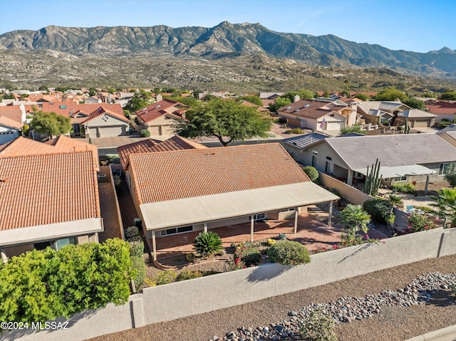 birds eye view of property featuring a mountain view