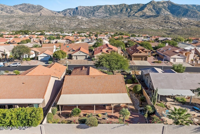 birds eye view of property with a mountain view