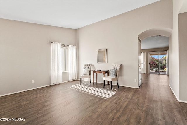 sitting room with dark hardwood / wood-style flooring