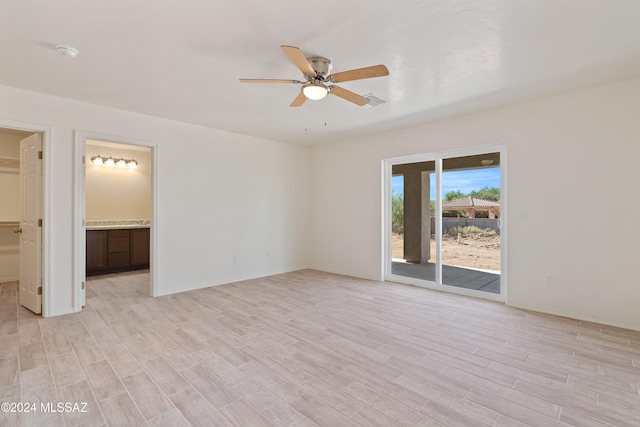 unfurnished room featuring ceiling fan and light wood-type flooring