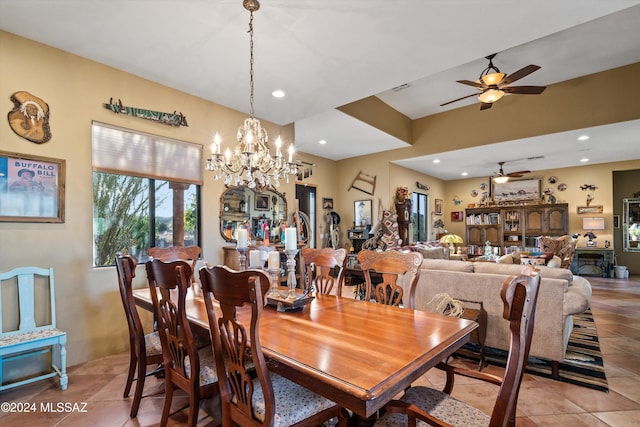 19931 S Sterling Ave, Mammoth, AZ 85618 - dining area with ceiling fan with notable chandelier and light tile patterned floors