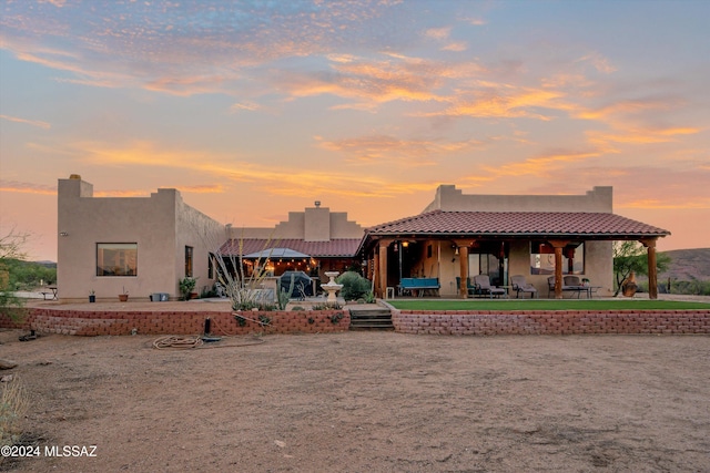 19931 S Sterling Ave, Mammoth, AZ 85618 - back house at dusk with a patio