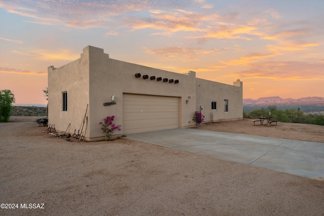 19931 S Sterling Ave, Mammoth, AZ 85618 - pueblo-style house with a mountain view and a garage