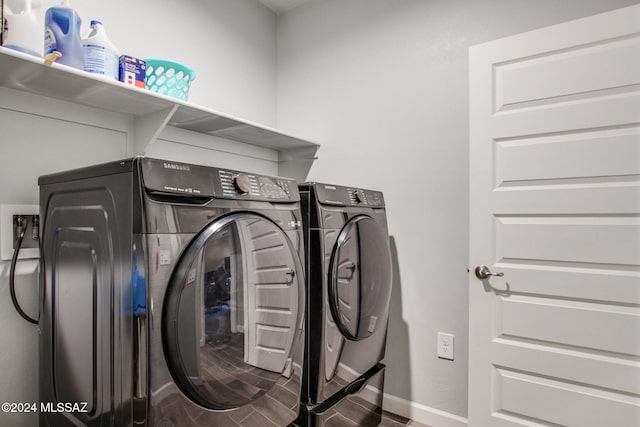 laundry area with wood-type flooring and separate washer and dryer