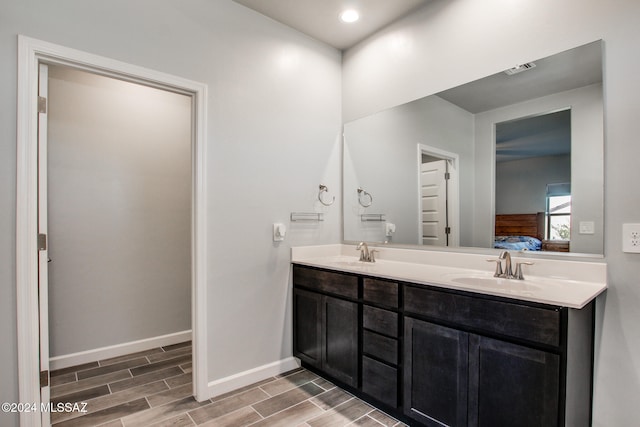 bathroom featuring vanity, toilet, and hardwood / wood-style floors