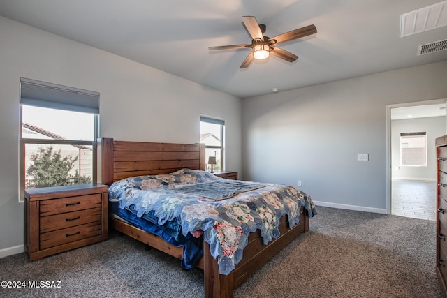 bedroom featuring dark carpet and ceiling fan