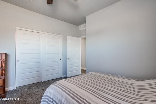 carpeted bedroom with a closet and ceiling fan