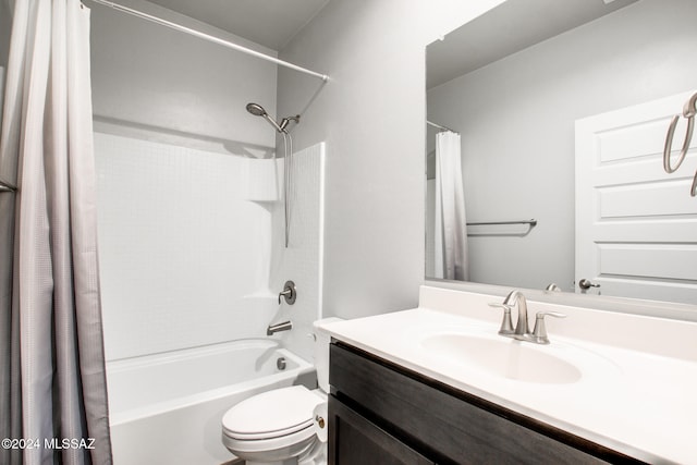 full bathroom featuring vanity, toilet, and shower / bath combo with shower curtain