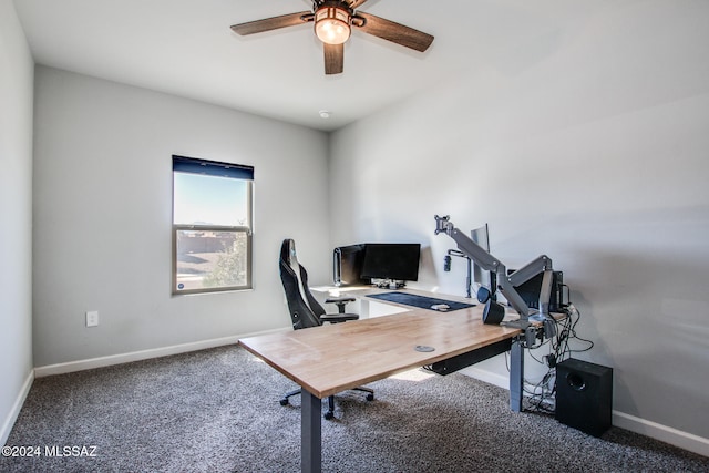 carpeted office featuring ceiling fan