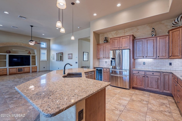 kitchen with a large island, sink, stainless steel appliances, and wine cooler