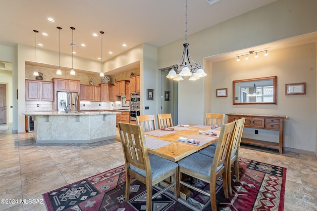 dining space with an inviting chandelier and sink