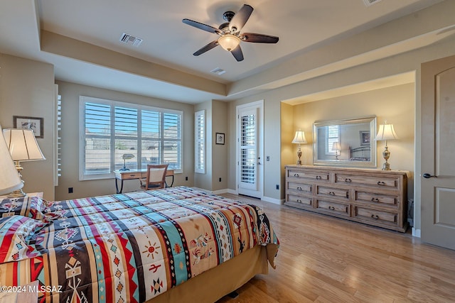 bedroom with access to outside, ceiling fan, and light hardwood / wood-style flooring