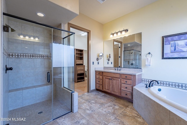 bathroom with shower with separate bathtub and vanity