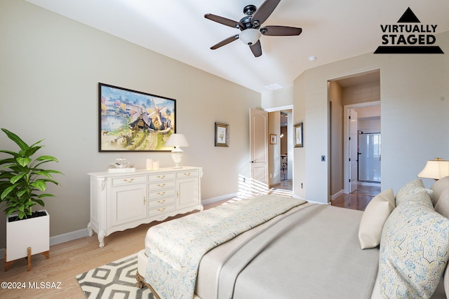 bedroom with connected bathroom, ceiling fan, and light wood-type flooring