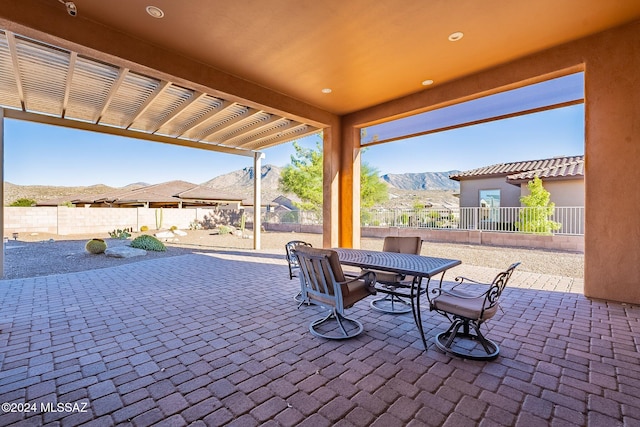 view of patio / terrace with a mountain view