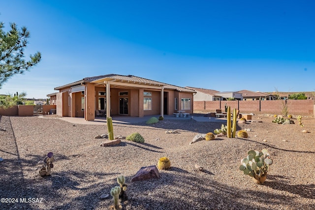 rear view of property with a patio