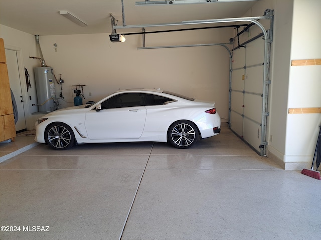 garage featuring a garage door opener and water heater