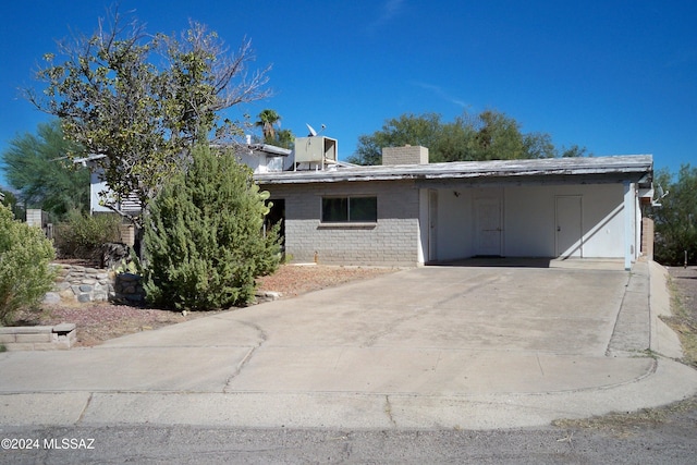 view of front of home featuring a carport