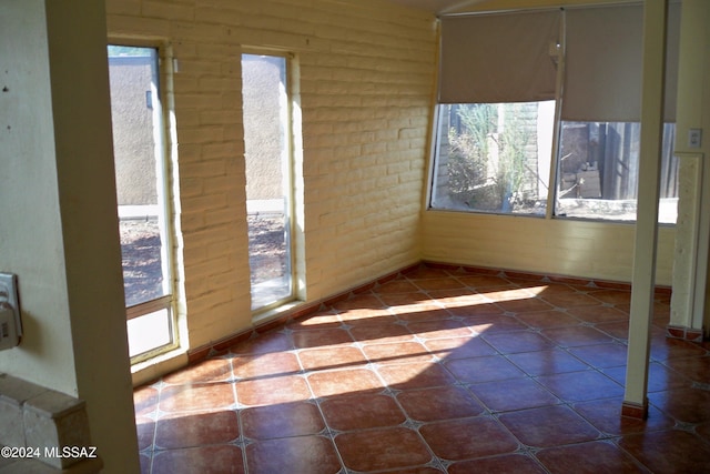 unfurnished sunroom featuring plenty of natural light