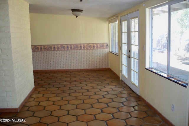 spare room featuring french doors