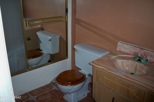 full bathroom with vanity, enclosed tub / shower combo, toilet, and tile patterned flooring