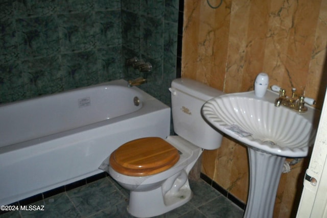 bathroom featuring toilet and tile patterned floors