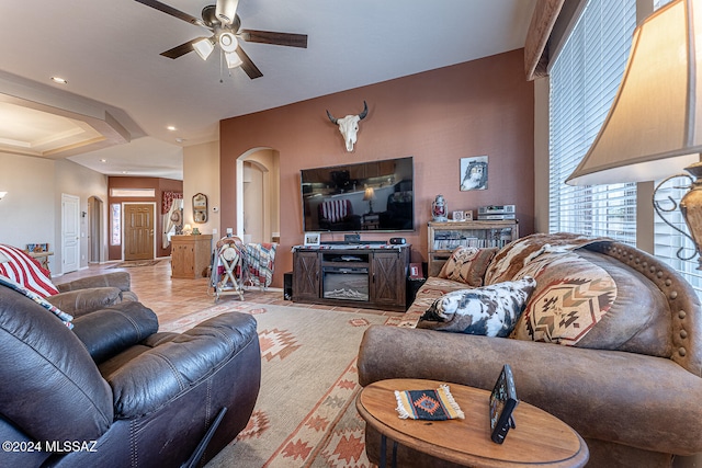 living room with ceiling fan and light tile patterned floors