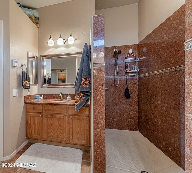 bathroom with vanity, a shower, and tile patterned flooring