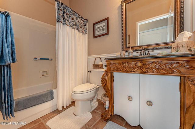 full bathroom with sink, tile patterned floors, toilet, and shower / bath combination with curtain