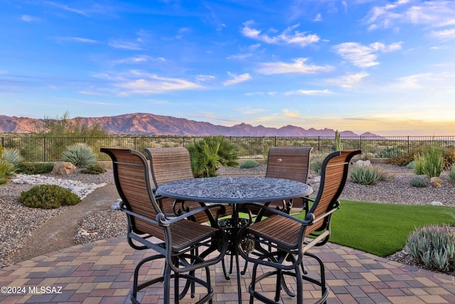 patio terrace at dusk with a mountain view