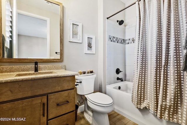 full bathroom with hardwood / wood-style flooring, vanity, toilet, and shower / bathtub combination with curtain